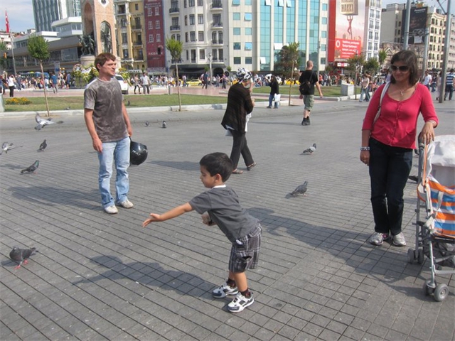 Adi and Sarita playing with pigeons